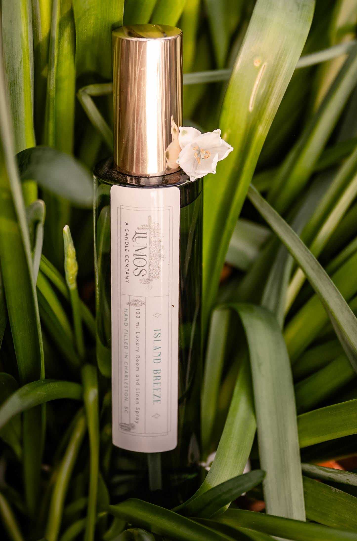 LUMOS Room + Linen Spray luxury home fragrance mist in elegant glass bottle with gold sprayer