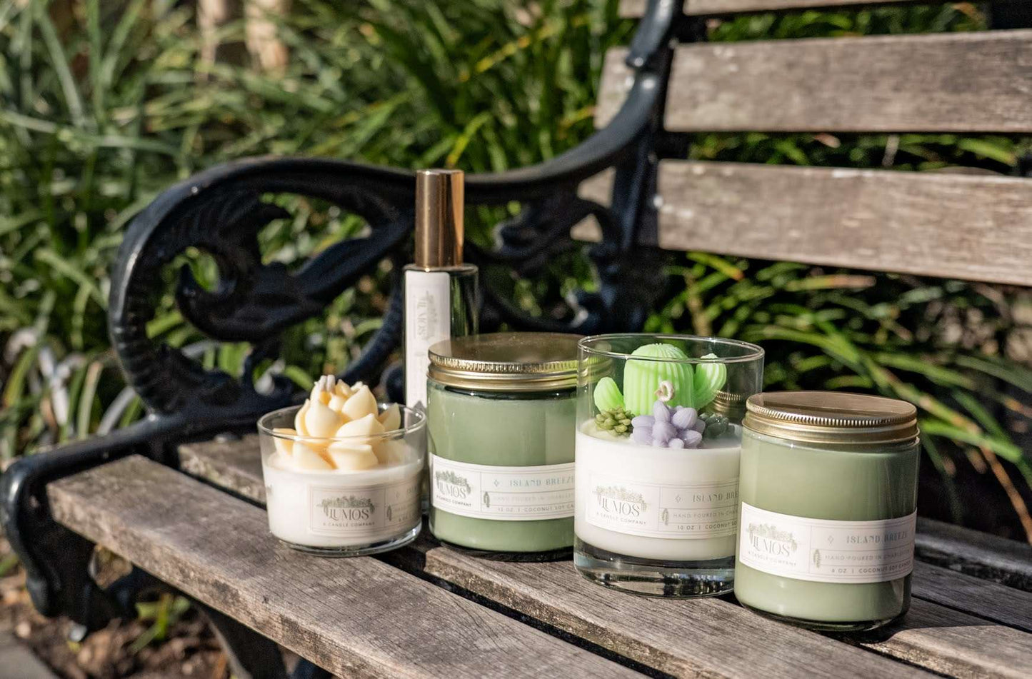 LUMOS Hand-Poured 12 oz coconut soy candle in green glass with gold lid for luxury home fragrance
