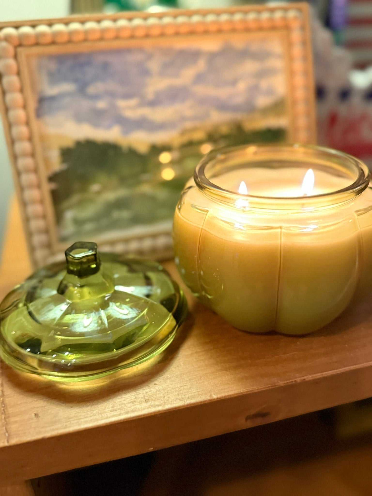 14 oz Green Glass Pumpkin Candle with a ribbed glass pumpkin vessel, two burning wicks, and a separate green lid.